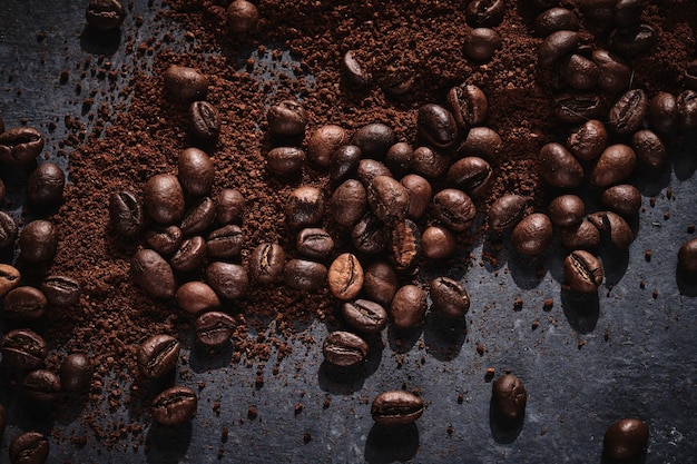 Roasted coffee beans on gray background