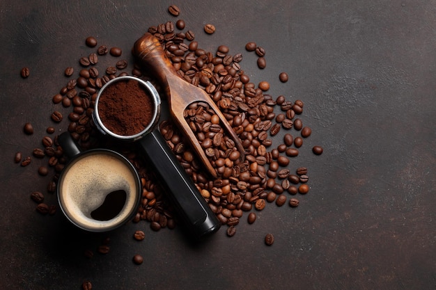 Roasted coffee beans and ground coffee in filter holder