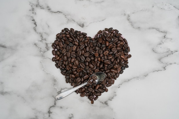 Roasted coffee beans. Heart with roasted coffee beans.