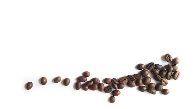 Roasted coffee beans isolated on a white background. Food and drink ingredients