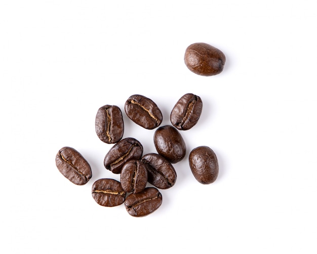 Roasted coffee beans isolated in white background. top view