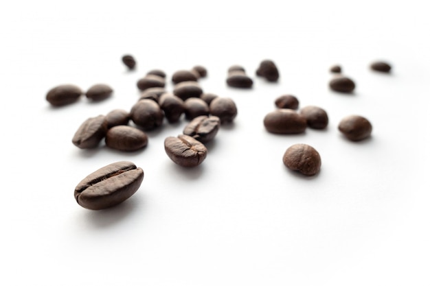 Roasted coffee beans isolated on white background.