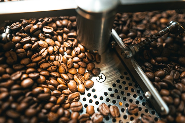 Roasted coffee beans in the machine at a coffee shop