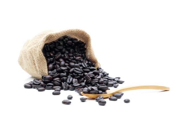 Roasted coffee beans in a sack of cloth on a white background