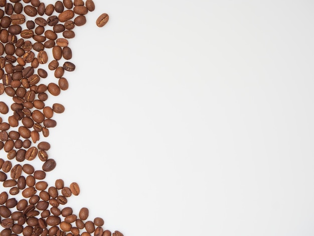 Roasted coffee beans on white background