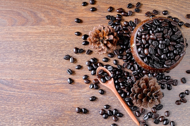 Roasted coffee beans in a wooden cup