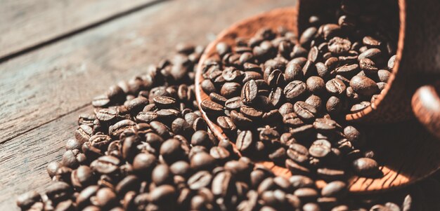 Roasted coffee beans in wooden cup