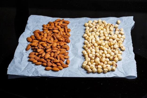 Roasted delicious nuts almonds and hazelnuts on a white background