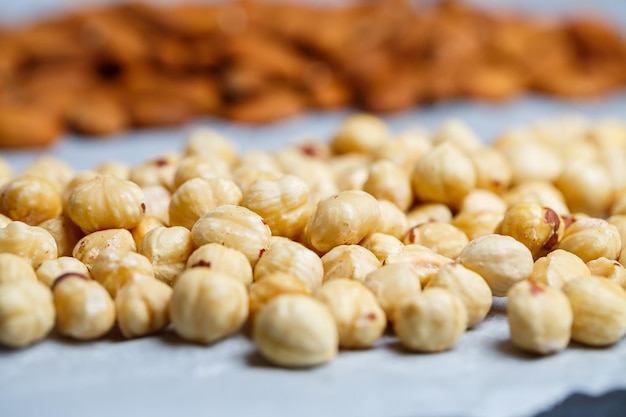 Roasted delicious nuts almonds and hazelnuts on a white background