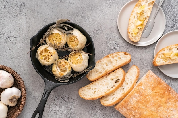 Roasted garlic spread recipe made with spices in cast iron skillet.