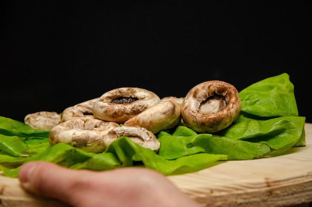 roasted mushrooms served on a green salad