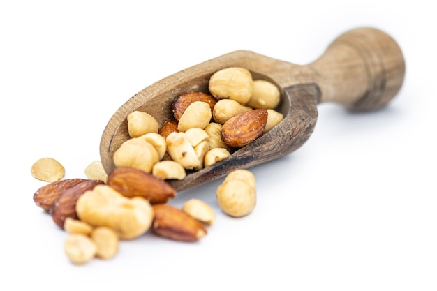 Roasted nuts isolated on white close up selective focus