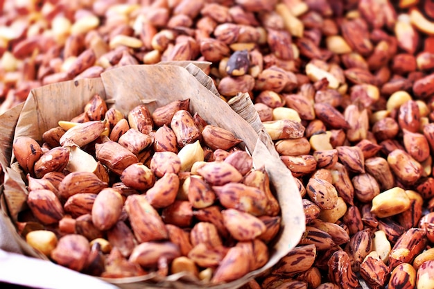 roasted peanuts mixed with salt vessel made of dried banana leaves 