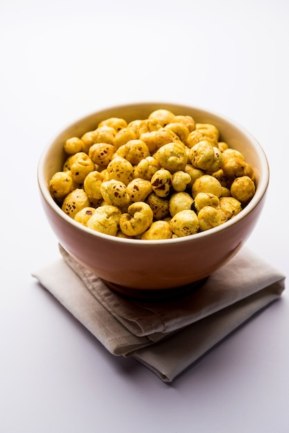 Roasted Phool Makhana or Crispy Lotus pops Seed served in a bowl, selective focus