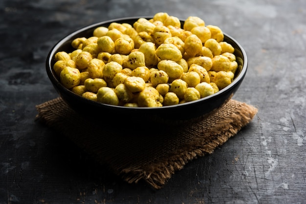 Roasted Phool Makhana or Crispy Lotus pops Seed served in a bowl, selective focus