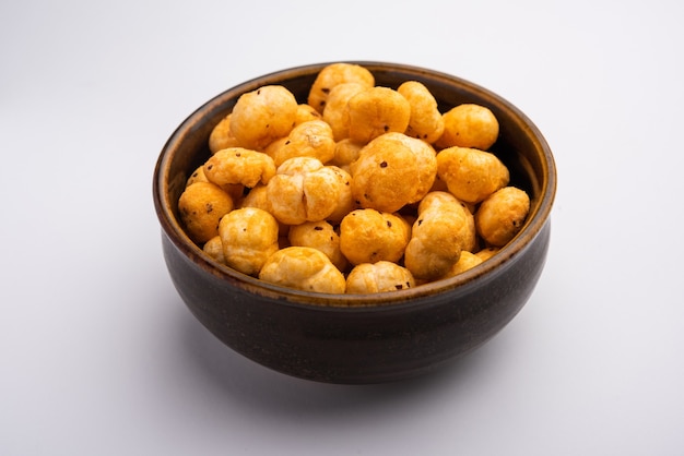 Roasted Phool Makhana or Crispy Masala  Lotus pops Seed served in a bowl, selective focus