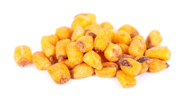 Roasted salted corn nuts isolated on white background. Beer snack, dry corn with spices.