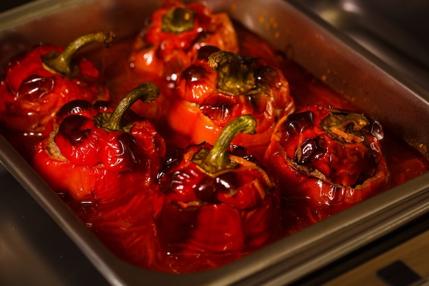 Roasted stuffed red pepper in a tray of food in the hotel's restaurant serves Breakfast,lunch,dinner