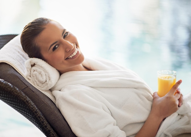 Robe smile and woman in hotel juice and relax in vacation travel and portrait in resort in USA Happy girl and beverage to drink morning and hospitality for luxury break and getaway for person