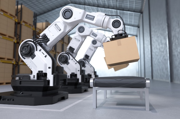 The Robot arm picks up the cardboard box in the warehouse