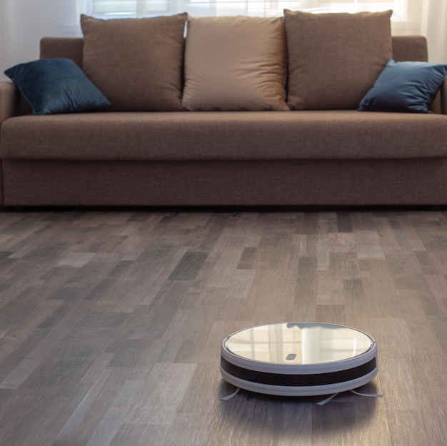 Robot vacuum cleaner on the floor in living room