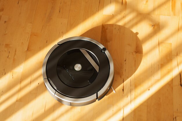 Robotic vacuum cleaner on laminate wood floor smart cleaning technology