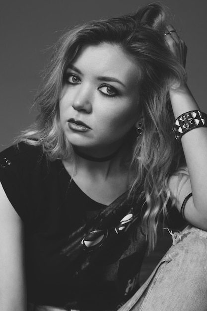 Rock baby. Fashion portrait of a young beautiful girl in the studio