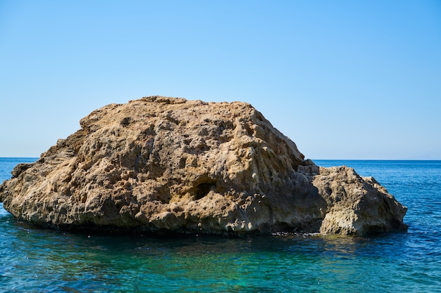 Rock and blue sea background