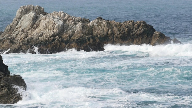 Rock crag of cliff ocean beach point lobos california coast waves crashing