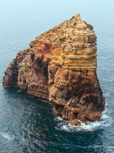 Rock formations near shore. Summer Atlantic rocky coast view (Costa Vicentina, Algarve, Portugal).