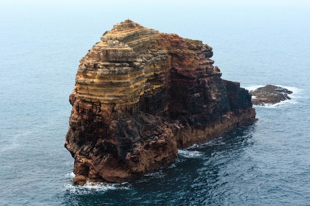 Rock formations near shore Summer Atlantic rocky coast view Costa Vicentina Algarve Portugal