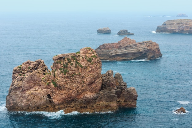 Rock formations near shore Summer Atlantic rocky coast view Costa Vicentina Algarve Portugal