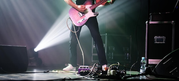 Rock guitarist on a stage playing music