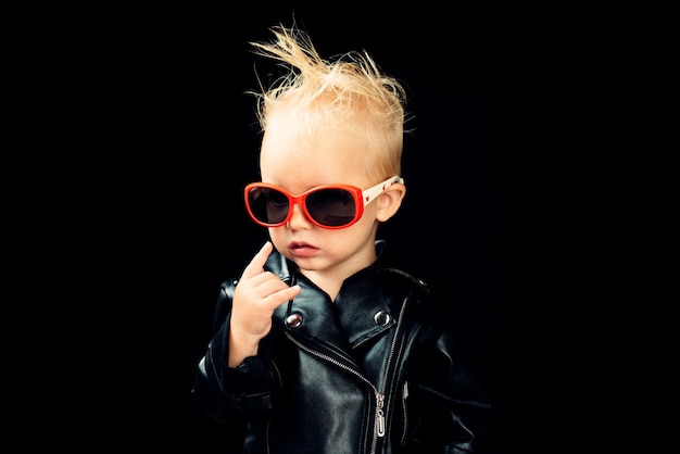 Rock music is in my soul Rock style child Little child boy in rocker jacket and sunglasses Little rock star Rock and roll fashion trend Adorable small music fan Music for children