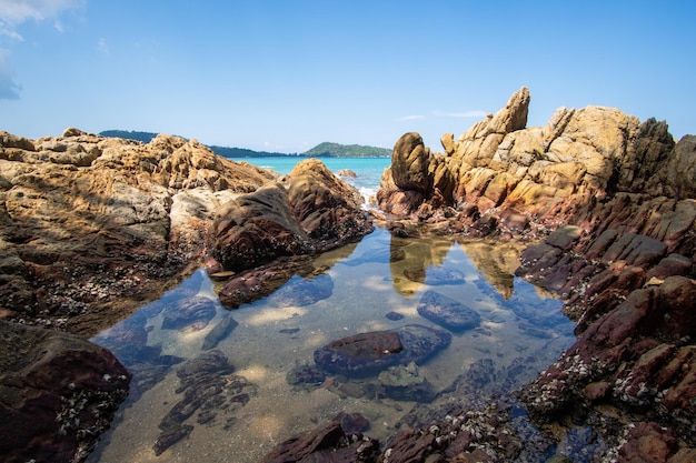 Rock niche sea view blue sky background