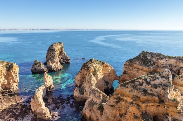 Rocks of the beaches of the city Luz, beach Senhora da Rocha