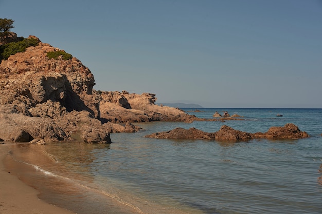 Rocks, crystal clear sea water and sun the perfect symbol of a summer holiday in a true paradise
