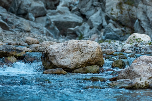 Rocks in a mountain stream at the bottom of the canyon close-up