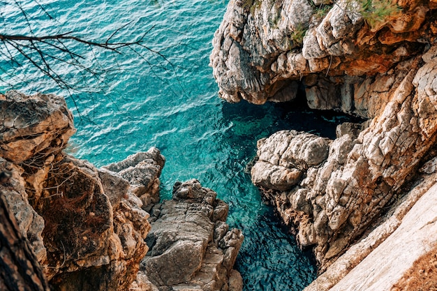 Rocks on the sea in montenegro rocky coast wild beach dangero