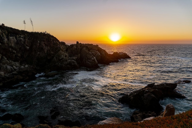 Rocks in a sunset by the sea in the Ocean Rock park at Concon Chile