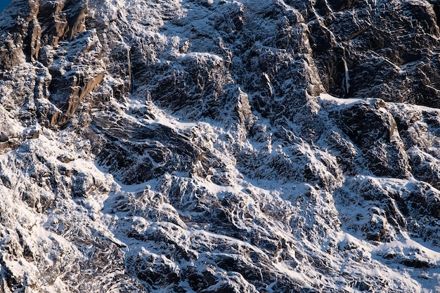 Rocks with snow as a background Texture effect for design Natural material