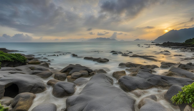 a rocky beach with a sunset in the background