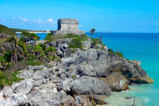 Rocky cliff on the shore of the Caribbean in Tulum Mexico