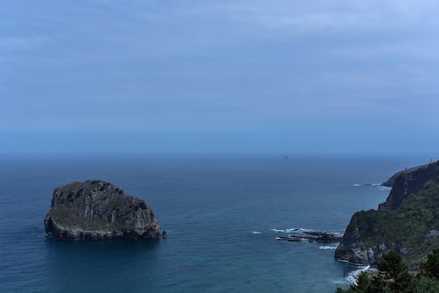 Rocky island, horizon line & rocky coast