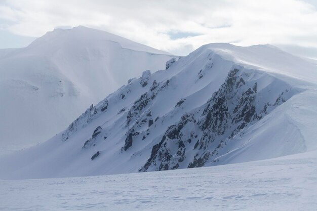 Rocky mountains and snow cornices winter freeride extreme