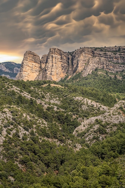 Rocky mountains with atmospheric stormy weather with clouds and cumulus clouds in the stormy sky