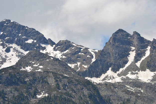 Rocky peak of the mountain covered with snow Alps in Austria