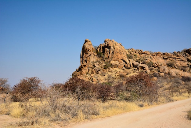 A rocky ridge in the desert against a clear blue sky Hot climate and dehydration