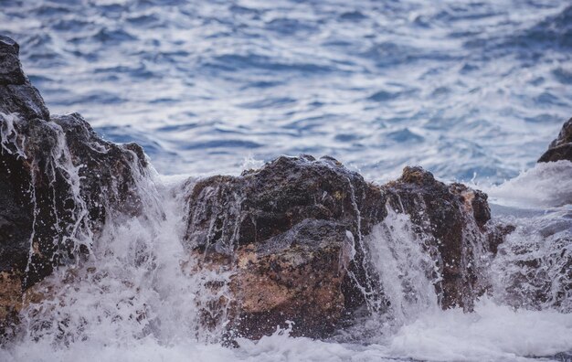 Rocky sea coast beautiful turquoise waters of the sea ocean waves against the coastal rocks scenery