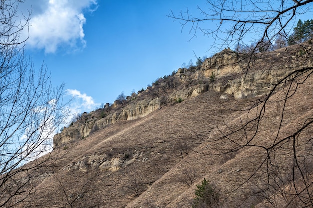 Rocky slope of a mountain range in a clear sunny day